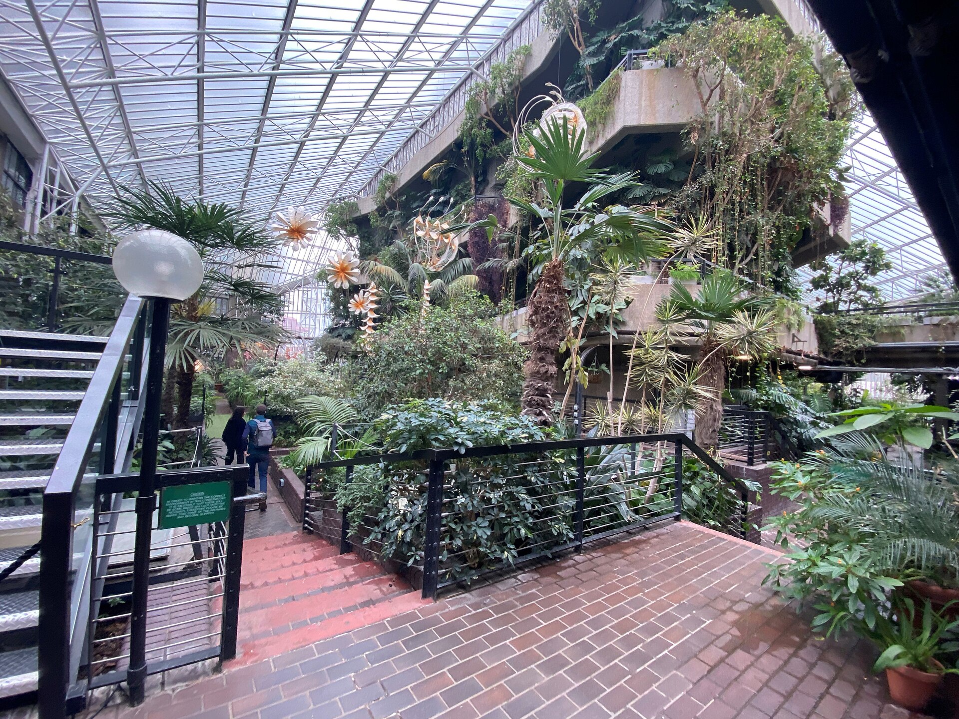 Plants, walkways and glass roof inside the Barbican Conservatory